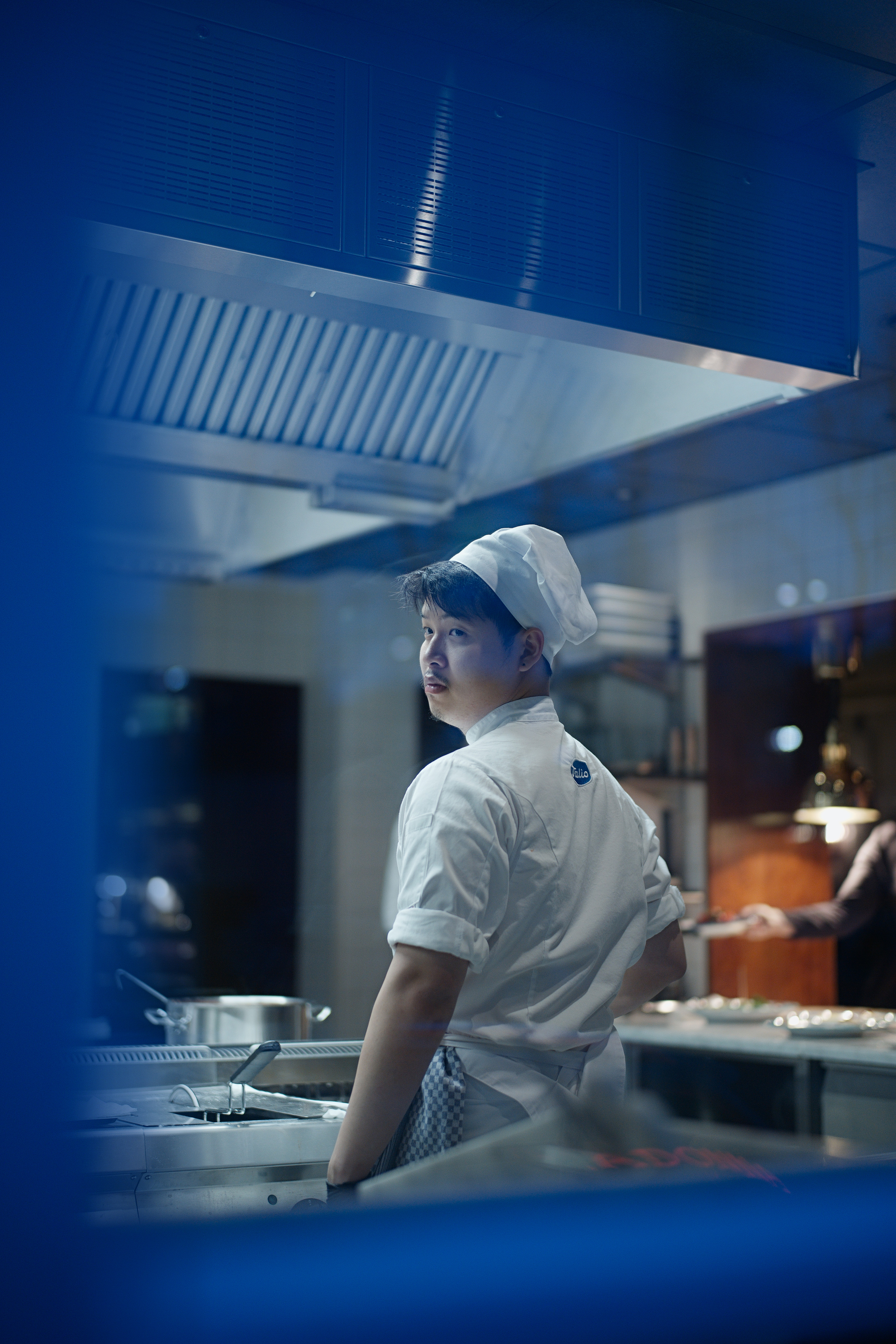 A cook in a kitchen.